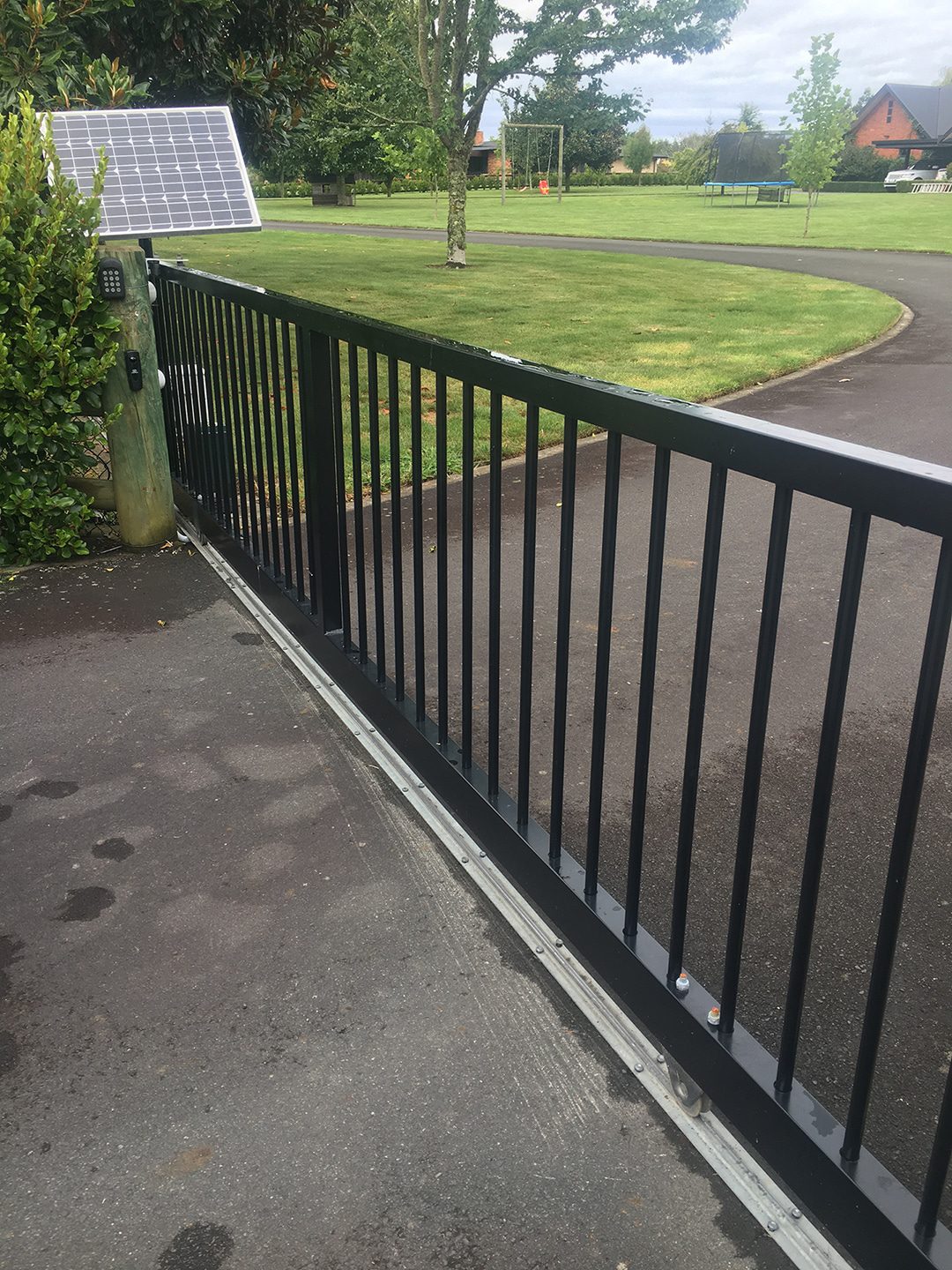 Automated sliding gate with solar panel and keypad entry